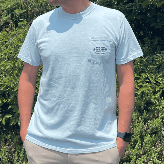 Man wearing the Chambray Meat Sweats summer pocket tee, front pocket logo