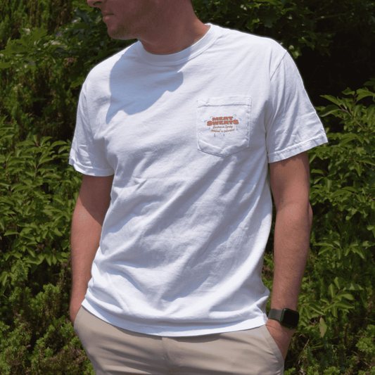 Man wearing the white Meat Sweats summer pocket tee, front pocket logo