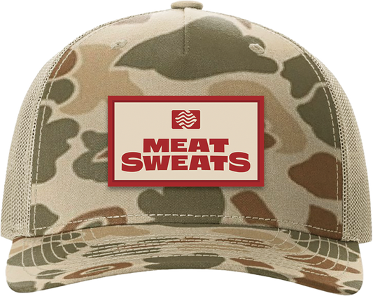 Front of Meat Sweats camo hat with red-and-cream custom logo patch