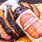 Meat Sweats Bull Spritz BBQ spritz bottle with sliced smoked brisket