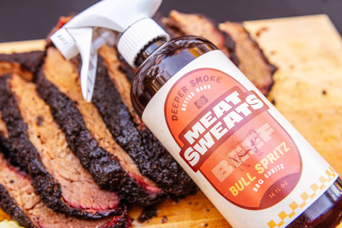 Meat Sweats Bull Spritz BBQ spritz bottle with sliced smoked brisket