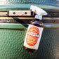 Meat Sweats Bull Spritz BBQ spritz bottle beside a ceramic smoker